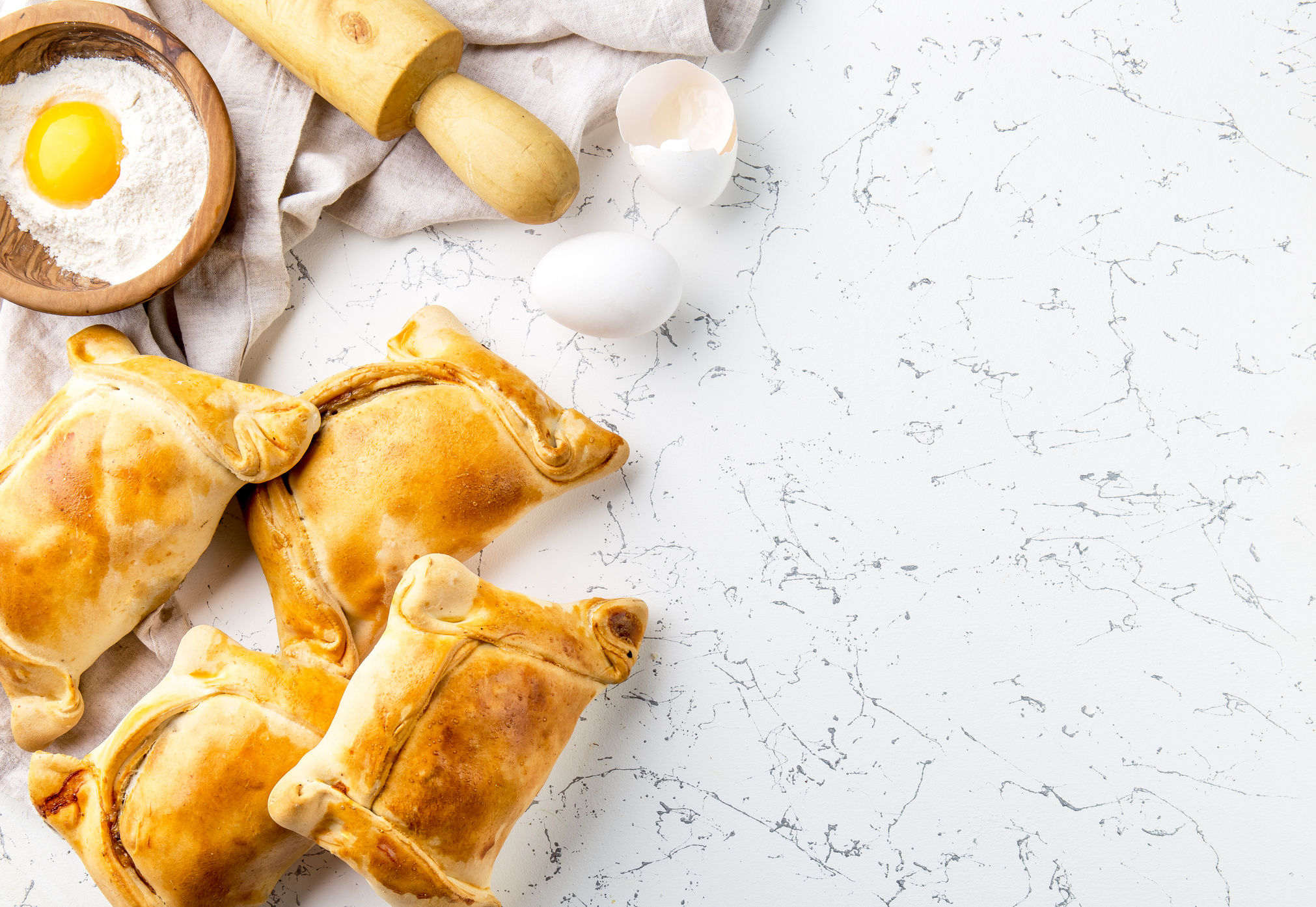 Chilean EMPANADAS DE PINO. Independence day baking concept. Empanadas on white background.